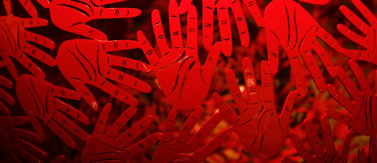 A close up of a window with red glass